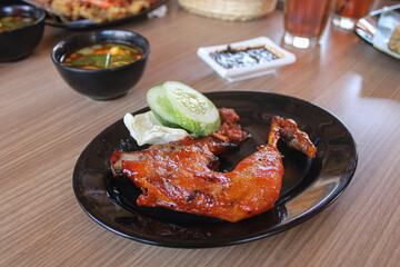 Grilled Spicy Chicken Leg with Sambal and Fresh Cucumber Slices
