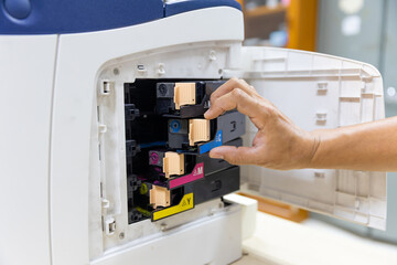 Technician Holding ink printer toner low for replace new or fix repair problem paper or print...