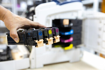 Technician Holding ink printer toner low for replace new or fix repair problem paper or print...