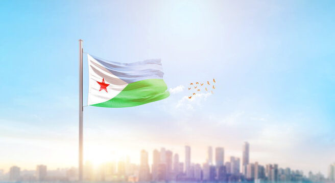 Djibouti national flag waving with skyline and buildings. A beautiful view of flag with skyline.