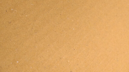 Background of brown kraft paper or cardboard texture. Abstract pattern of beige rough carton,