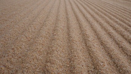Abstract background of straight wavy sand.