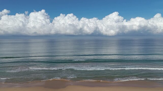 Aerial 4K drone footage of Bentota Beach, Sri Lanka. Beautiful tropical coastline, golden sands, palm trees, and turquoise waters ideal for travel, tourism, beach, and tropical vacation projects.