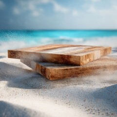 Two wooden squares on sandy beach, ocean backdrop