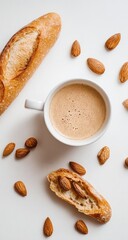 Coffee, bread, and almonds on white