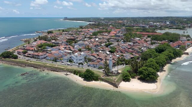 Aerial 4K drone footage of Galle Fort and coastline, Sri Lanka. Stunning views of historic Dutch Fort, lighthouse, beaches, and Indian Ocean&mdash;perfect for travel, tourism, and cultural projects