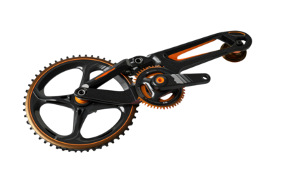 Close-up of a bicycle drivetrain, black frame with orange accents