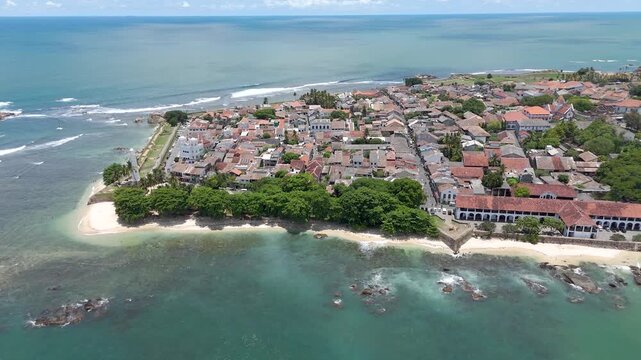 4K drone footage showcasing Galle Fort and the beautiful Sri Lankan coastline showcasing the historic streets, the iconic lighthouse, and sweeping ocean views from above.