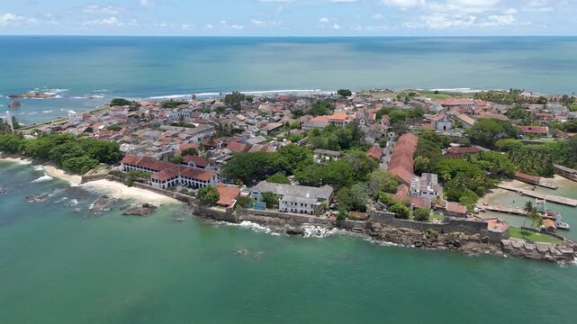 4K drone footage showcasing Galle Fort and the beautiful Sri Lankan coastline showcasing the historic streets, the iconic lighthouse, and sweeping ocean views from above.