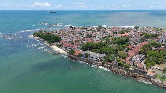 4K drone footage showcasing Galle Fort and the beautiful Sri Lankan coastline showcasing the historic streets, the iconic lighthouse, and sweeping ocean views from above.