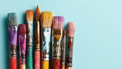 Fototapeta premium Paintbrushes in various colors, showing paint residue