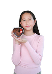 Asian girl child show chocolate cake topped with strawberry in heart tray isolated on white background.