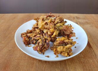 fried chicken wings,Soft shell crabs,Indonesian called Kepiting soka,the dish is crispy fried soft shell crabs,the crabs wrapped with seasoning flour.Deep fried soft shell crabs.It served with spicy s