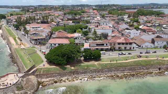 4K drone footage showcasing Galle Fort and the beautiful Sri Lankan coastline showcasing the historic streets, the iconic lighthouse, and sweeping ocean views from above.