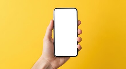 Hand Holding Smartphone with Blank Screen Against Yellow Background