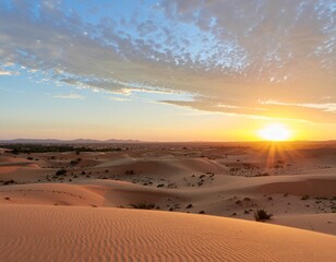 Breathtaking view of golden desert dunes at sunset with dramatic shadows and clear blue sky