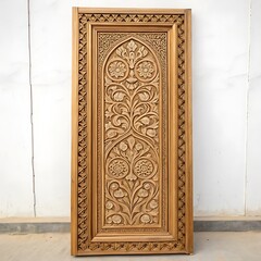 Ornate wooden door with floral carvings in detail