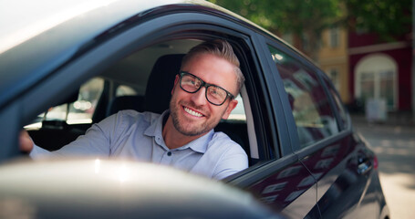 Smiling CEO Test-driving Sleek Transportation With Delighted Vehicle Salesman
