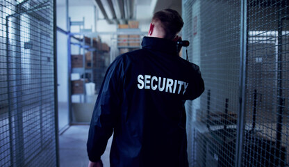 Nighttime Worker Inspecting Warehouse For Potential Hazards, Construction