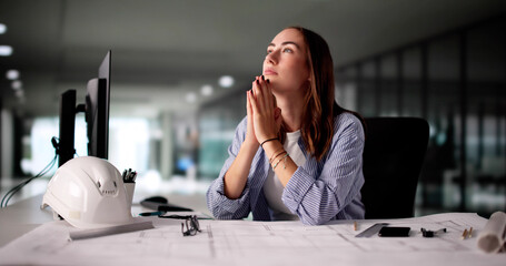 Architectural Engineer Praying For Guidance Using Technology