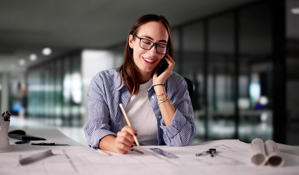 Female Architect Discusses Building Design Plans
