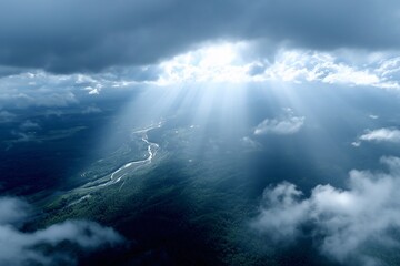 Naklejka premium sun rays streaming through clouds over winding river, vast forest landscape beneath, aerial view for dramatic scenery