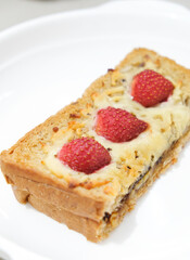 Homemade toast with cheese and strawberry topping