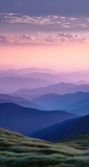 Obraz premium Mountain ranges fade into soft, pastel hues at dawn