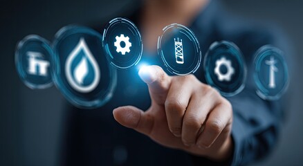 Close-up of a hand touching digital icons. Businessperson interacts with holographic interface displaying energy/utility-related symbols