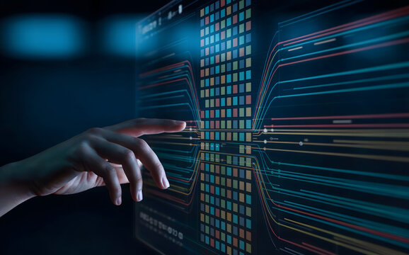 Hand interacting with a futuristic data visualization interface screen