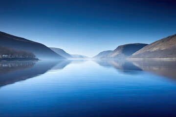 Naklejka premium Serene fjord reflecting a tranquil sky
