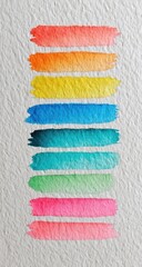 Vertical watercolor paint swatches in a spectrum of colors