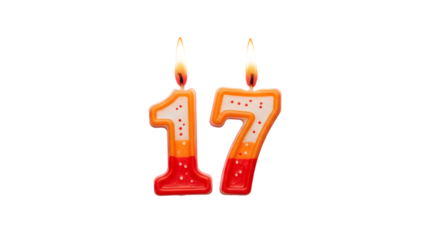 Illuminated number seventeen candles with orange and red details on a black background scene view