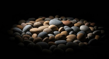 Smooth Gray and Brown River Rocks Dark Background
