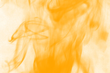 Fiery abstract dance of golden flames and wisps of smoke creating an energetic and dynamic visual...