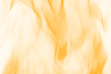 Close up view of vibrant orange and yellow flames dancing and flickering against a dark background...