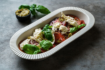 salad with tomatoes, mozzarella and basil