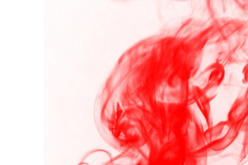 Fiery red smoke swirls against a dark black background creating an abstract and intense visual spectacle of light and movement