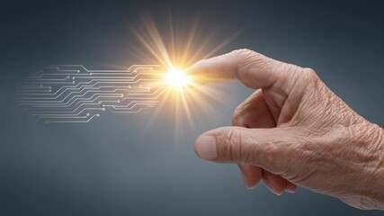 Elderly people and the use of technology. Learning new technological skills. An elderly finger touching a microchip, with sunburst rays emanating from the contact point.