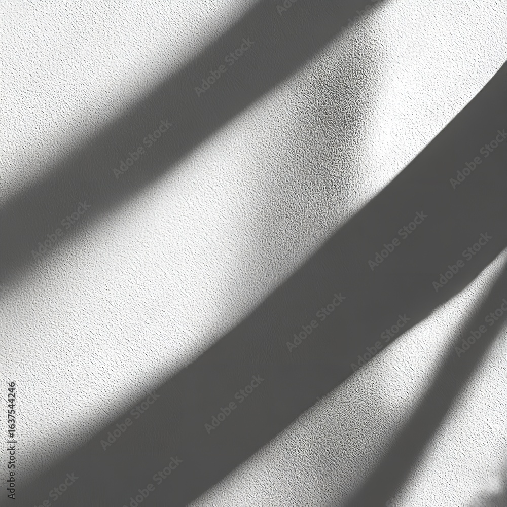 Poster a textured white wall with diagonal shadows creating a contrast of light and dark patterns across th