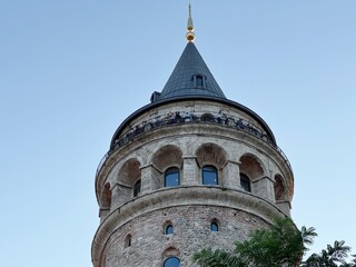 Evening view of the Galata Tower (Galata Kulesi) in Istanbul, Turkey. Built in the 14th century by...