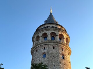 Evening view of the Galata Tower (Galata Kulesi) in Istanbul, Turkey. Built in the 14th century by...