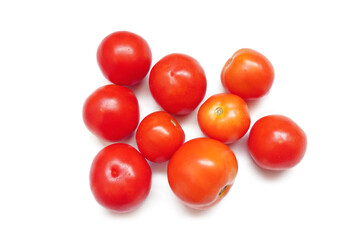 Tomato vegetables isolated on white background. Natural, organic and fresh whole tomatoes. Delicious and healthy ingredient for salads and seasonal food.