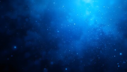 Abstract deep blue background with shimmering light and particles