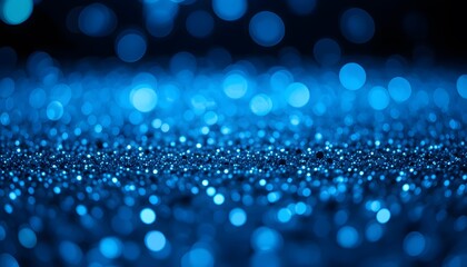 Abstract blue glitter background with soft bokeh lights