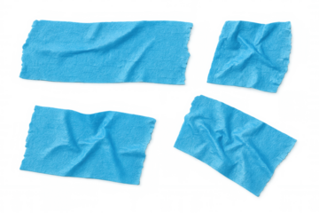 Blue masking tape fragments crumpling, lying scattered on transparent surface, showcasing adhesive texture and design potential