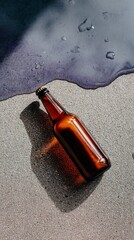 Blank beer bottle on wet granite surface in natural light for product design
