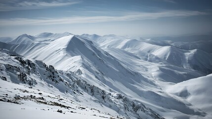 Obraz premium Snowy mountain range stretching into the distance.