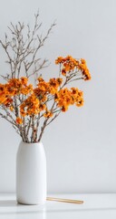 Dried orange flowers in white vase,  simple arrangement