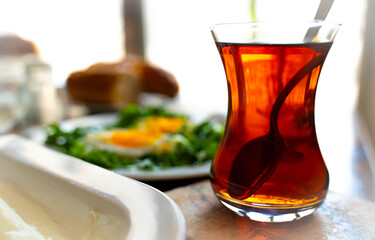 Traditional Turkish Breakfast with a Glass of Hot Tea